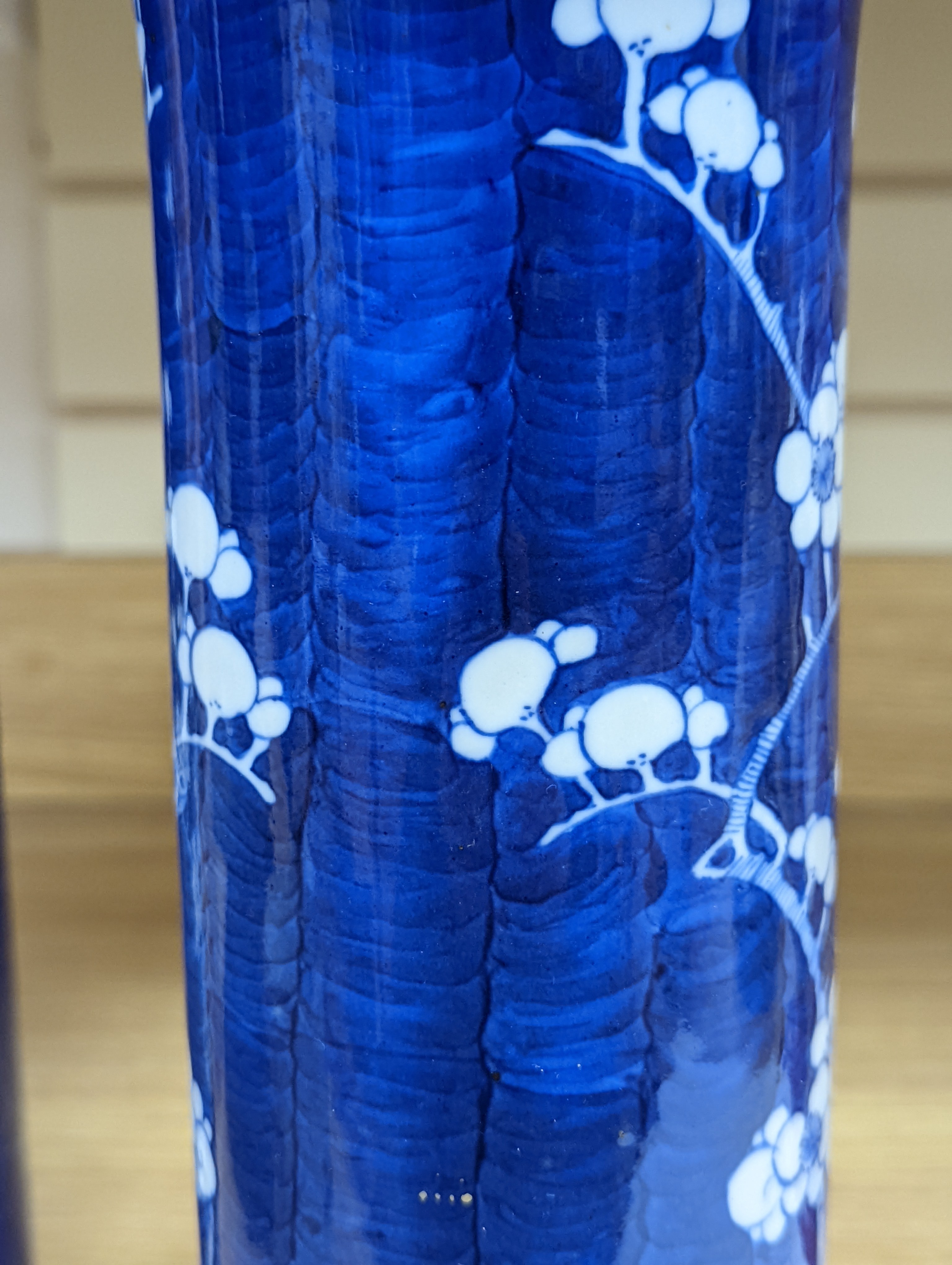 An 18th century Chinese famille rose mug, a Chinese Imari tea caddy and two Chinese blue and white sleeve vases 30cm (4)